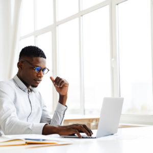 A professional interacting with a digital audience through a laptop